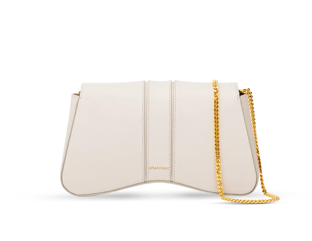 The back side of Marquise clutch bag in the Sand shade with detachable gold chain  
