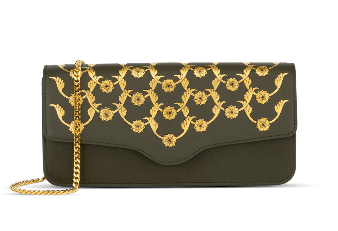 The Charvi Clutch Bag in Deep Forest Shade adorned with a beautiful 24K gold gilded design