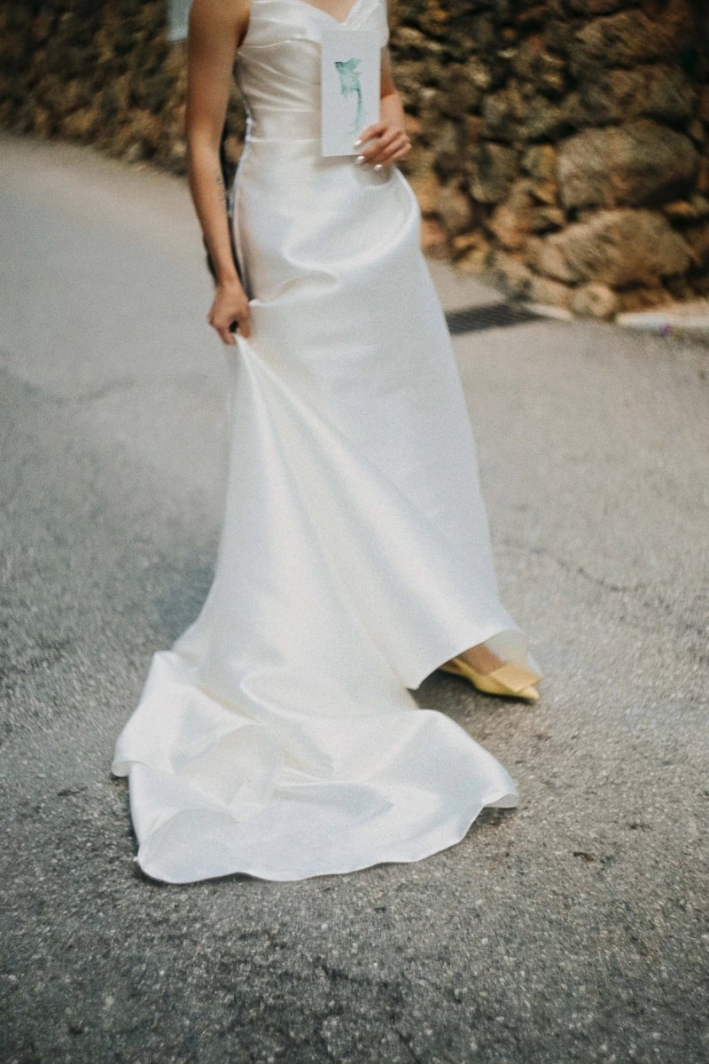 Candid wedding photography of a bride walking together after the ceremony