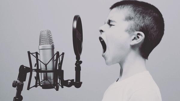 Child screaming in a microphone