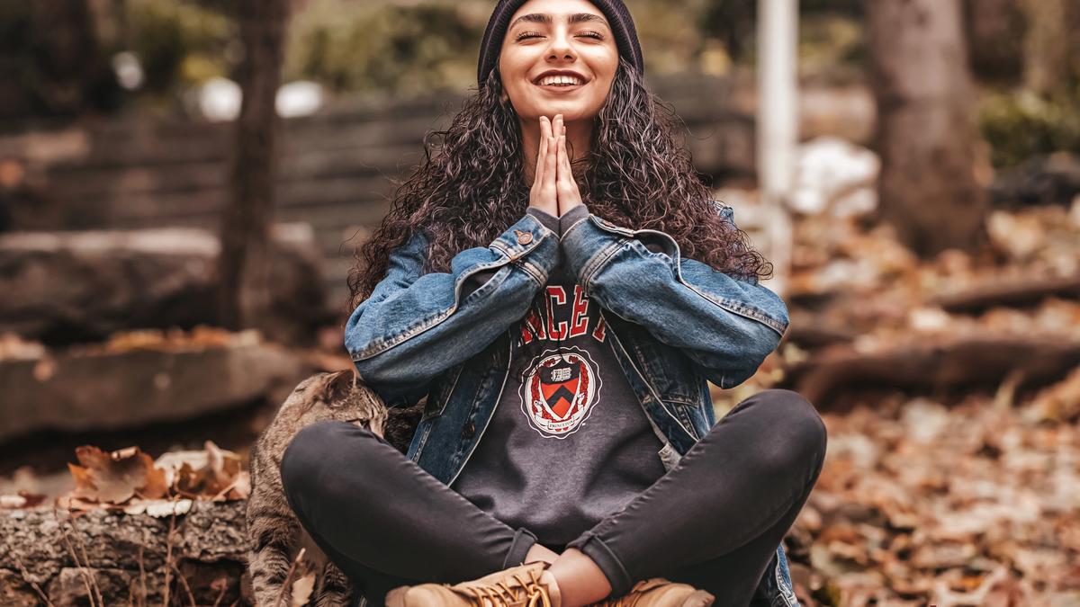 Woman in the woods meditating