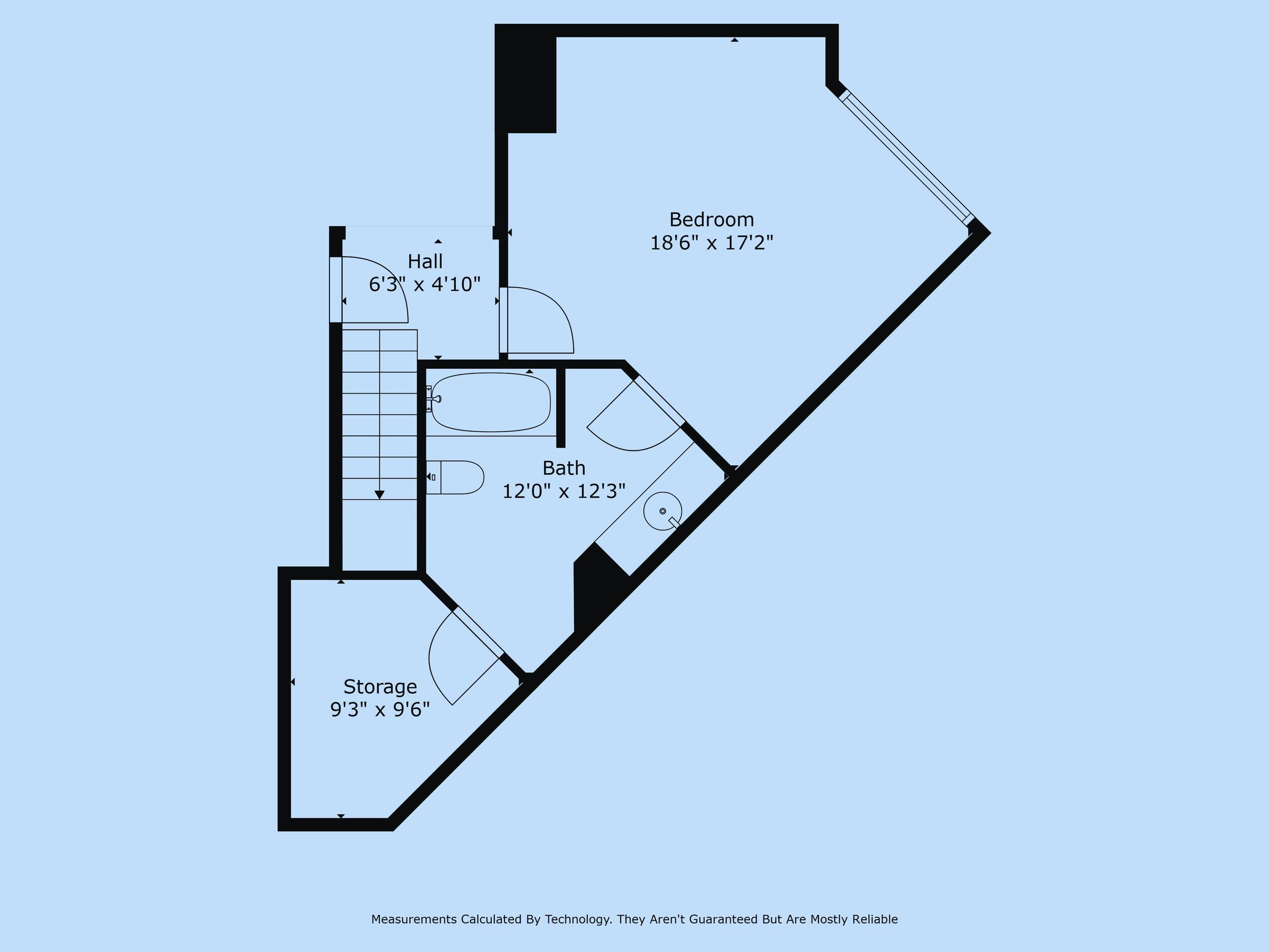 Black and white 2D floor plan of angled one-bedroom apartment unit with storage and staircase in Addison, Texas