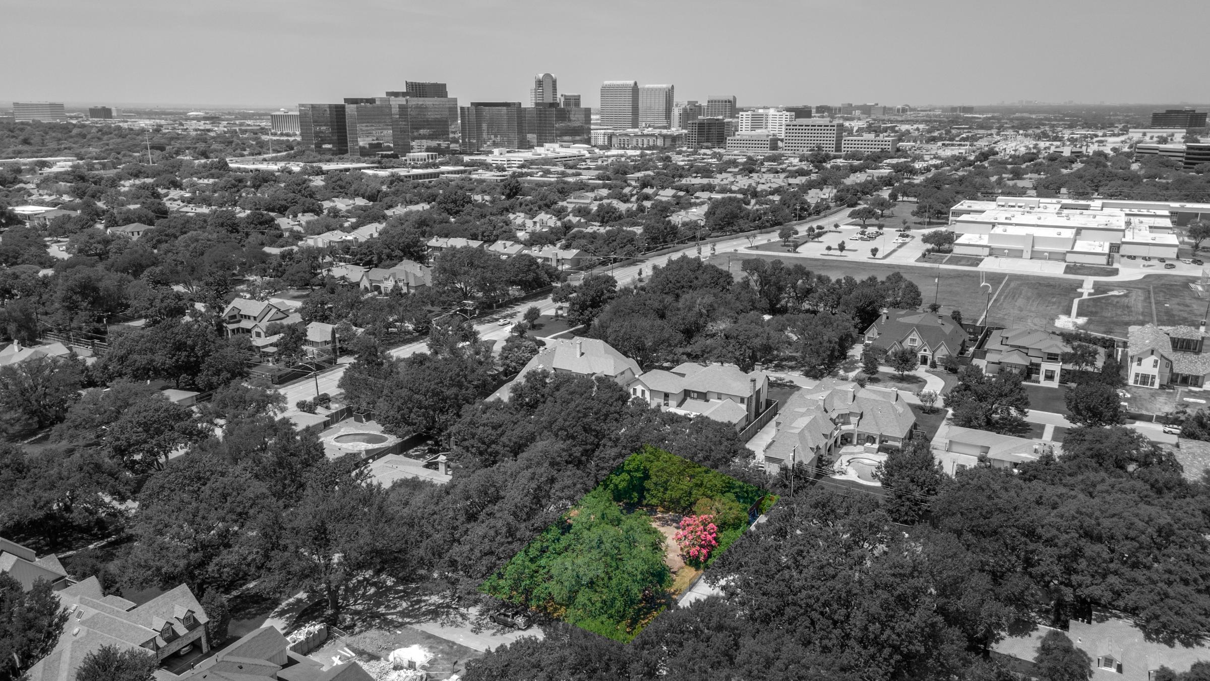 ColorPop aerial drone photography highlighting a property in color against a black and white neighborhood backdrop with Dallas skyline in Dallas, Texas