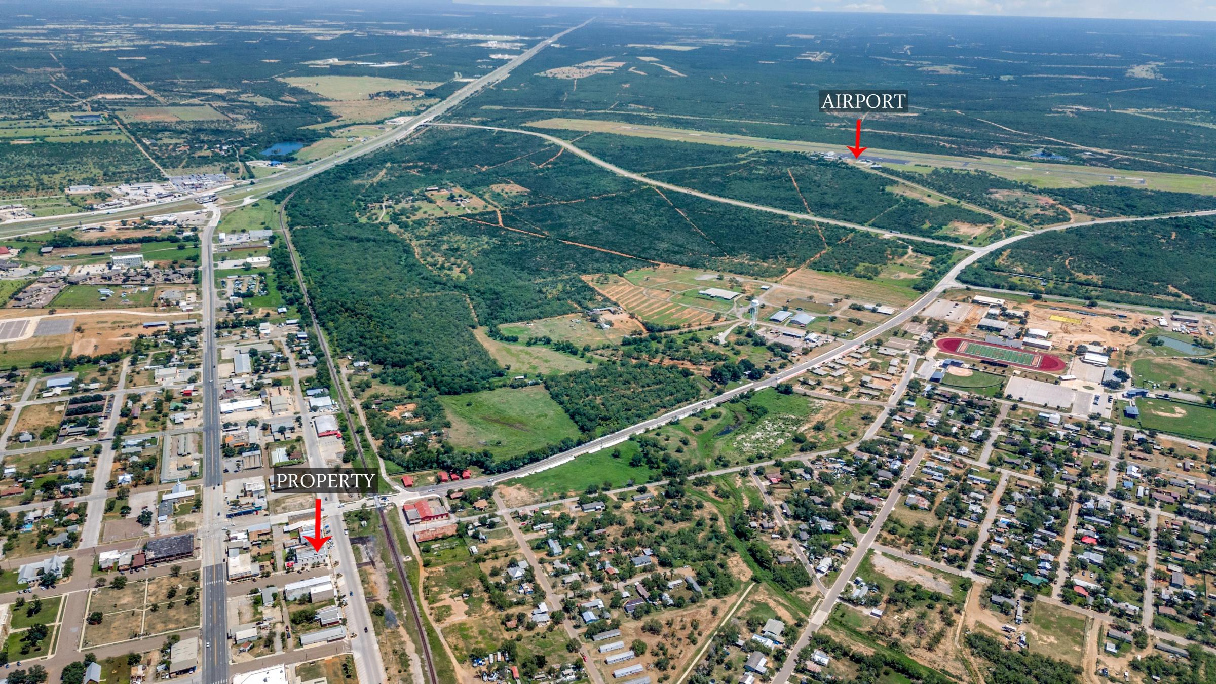 Annotated aerial photograph showing commercial property and nearby airport in Cotulla, Texas
