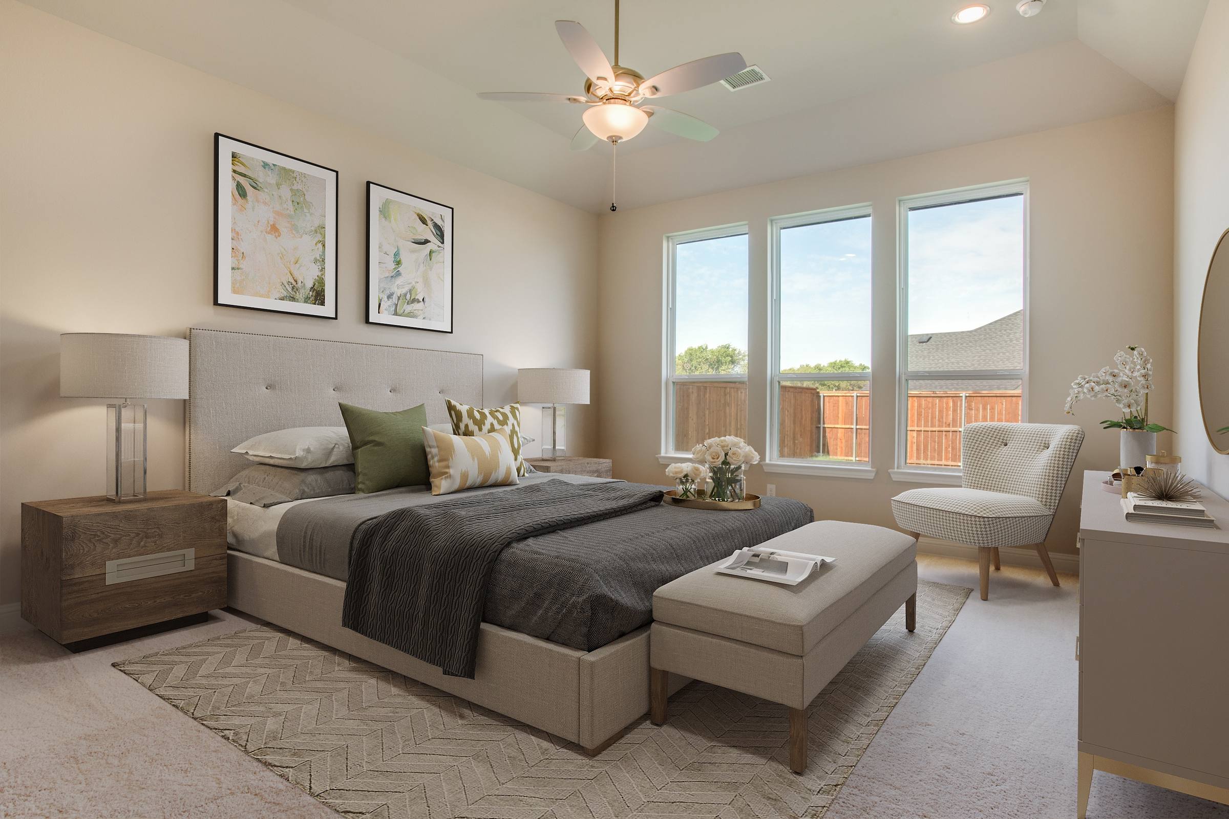 Virtually staged master bedroom with upholstered bed, nightstands, bench, and green accents in new construction home in Celina, Texas