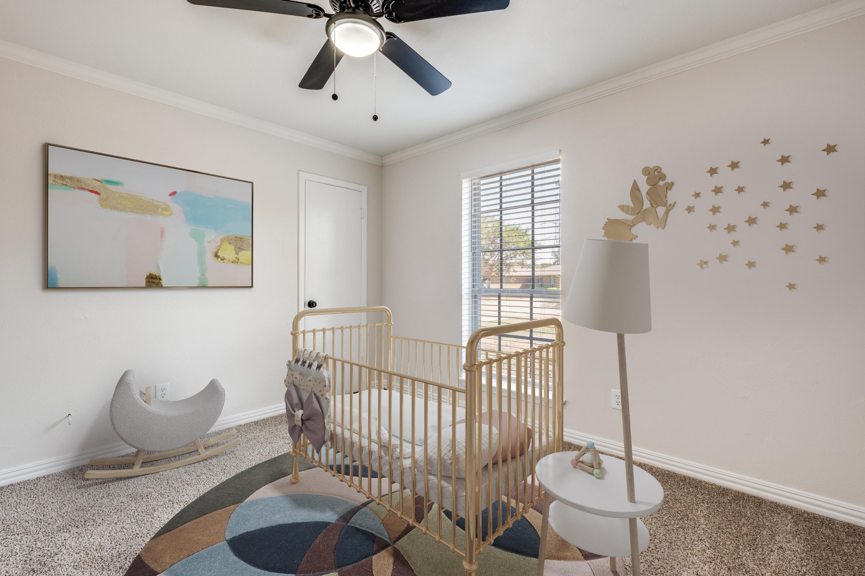 Virtually staged nursery with gold crib, moon rocker, colorful rug, wall art, and fairy decals in Mesquite, Texas