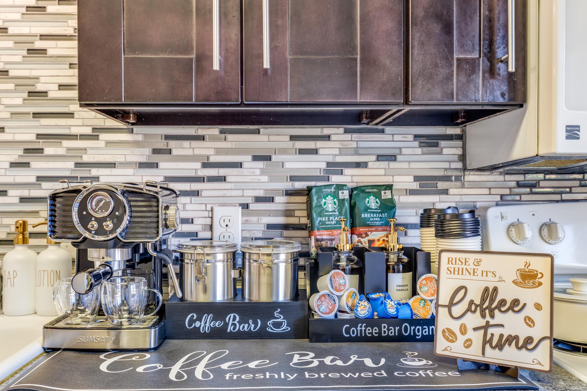 Styled coffee bar station with espresso machine, K-cups, and decorative signage in a Nacogdoches, Texas vacation rental