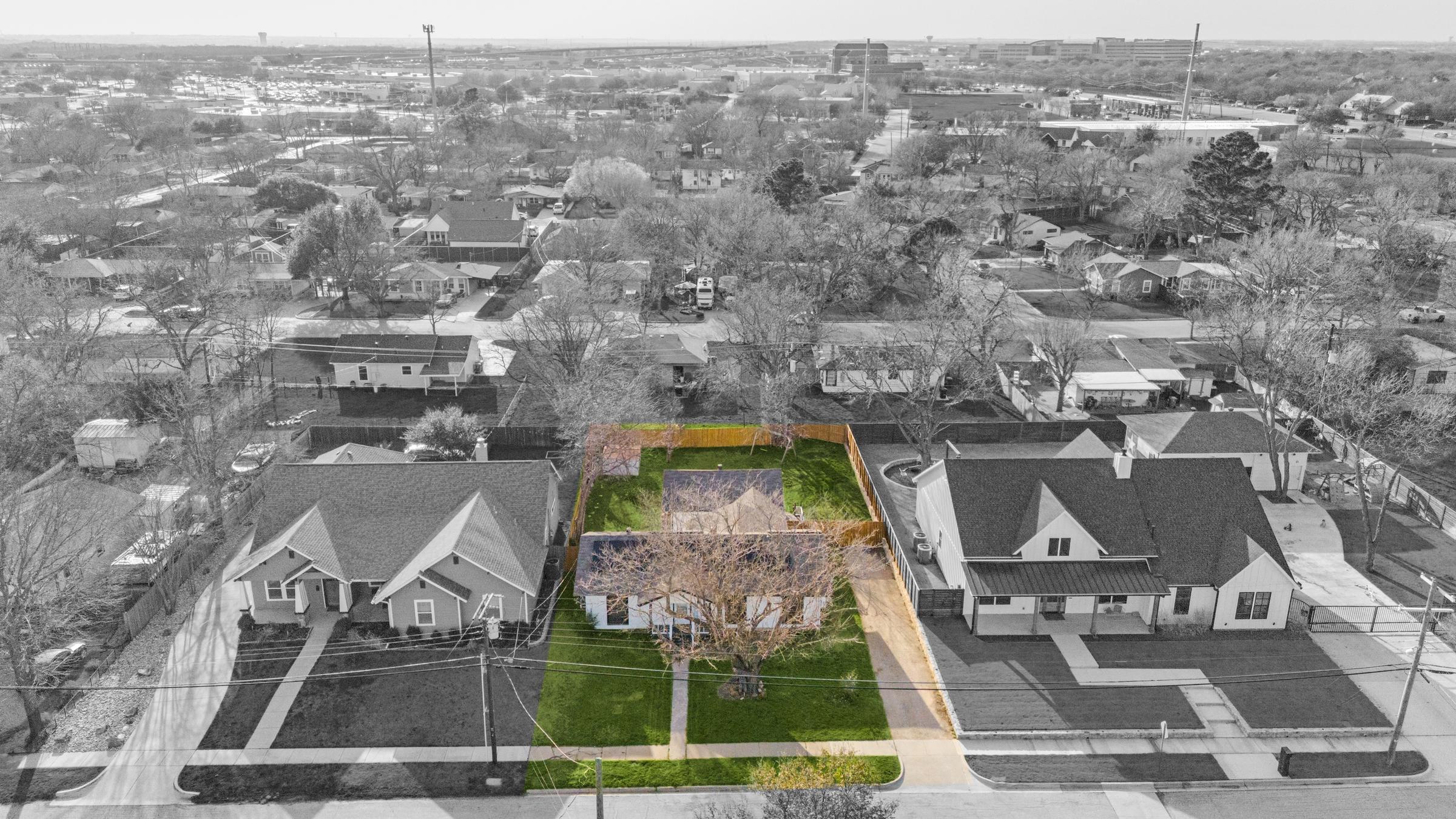 ColorPop aerial drone photography highlighting a home in color against a black and white neighborhood in Grapevine, Texas
