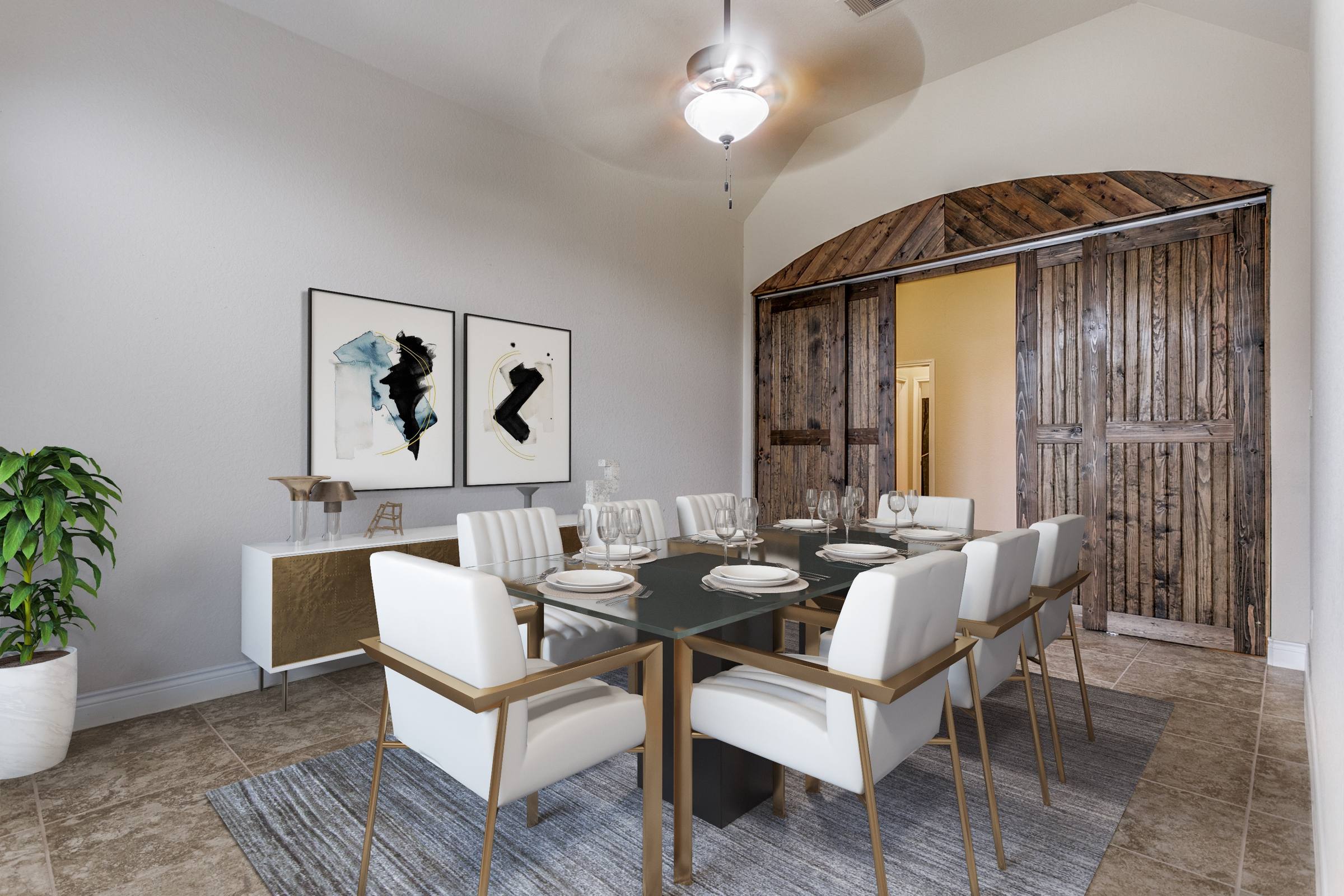 Virtually staged dining room with modern glass table and white leather chairs complementing rustic barn doors in New Braunfels, Texas