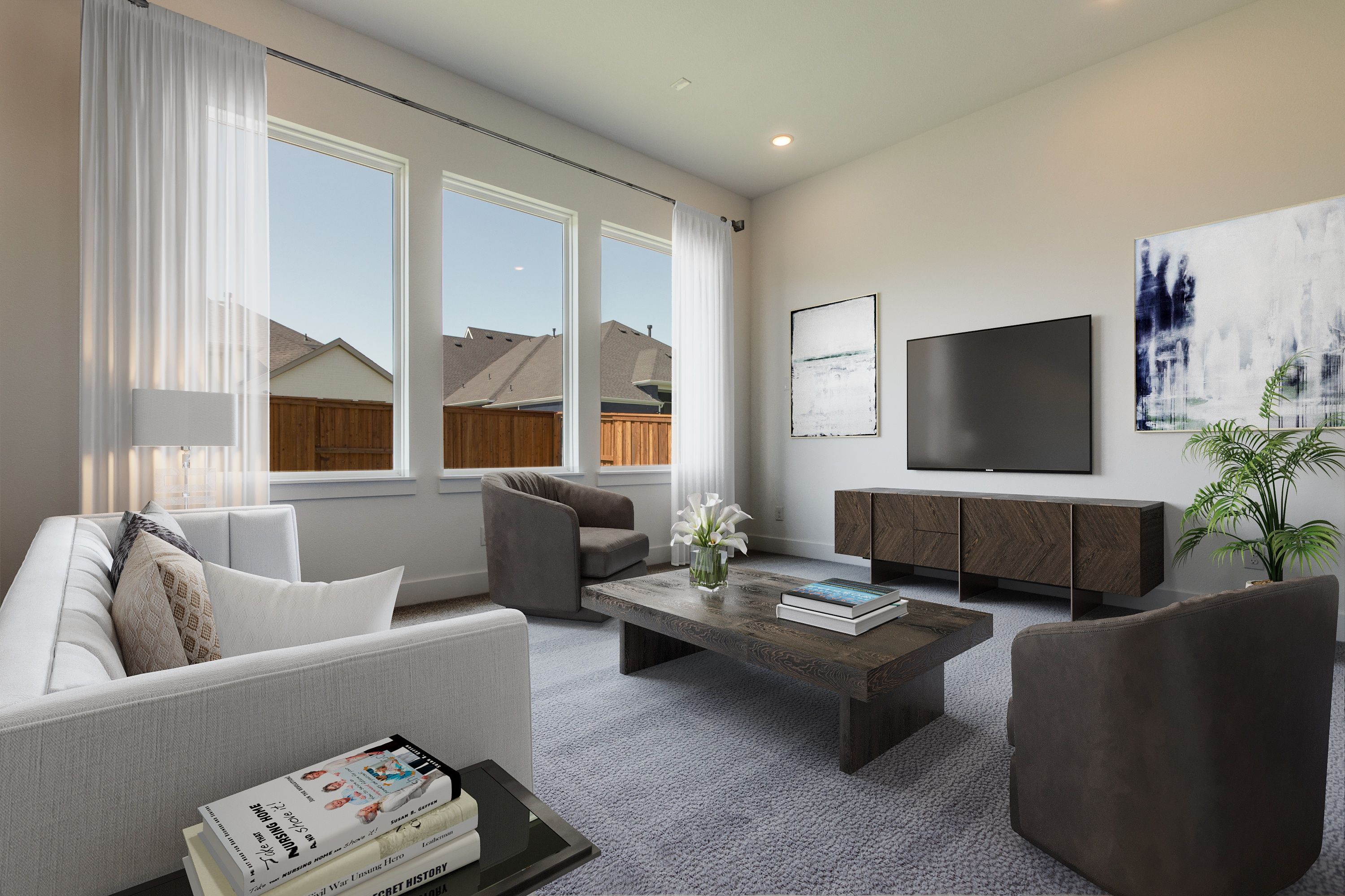 Virtually staged living room with modern gray sofas, wooden coffee table, and TV console in new construction home in Prosper, Texas