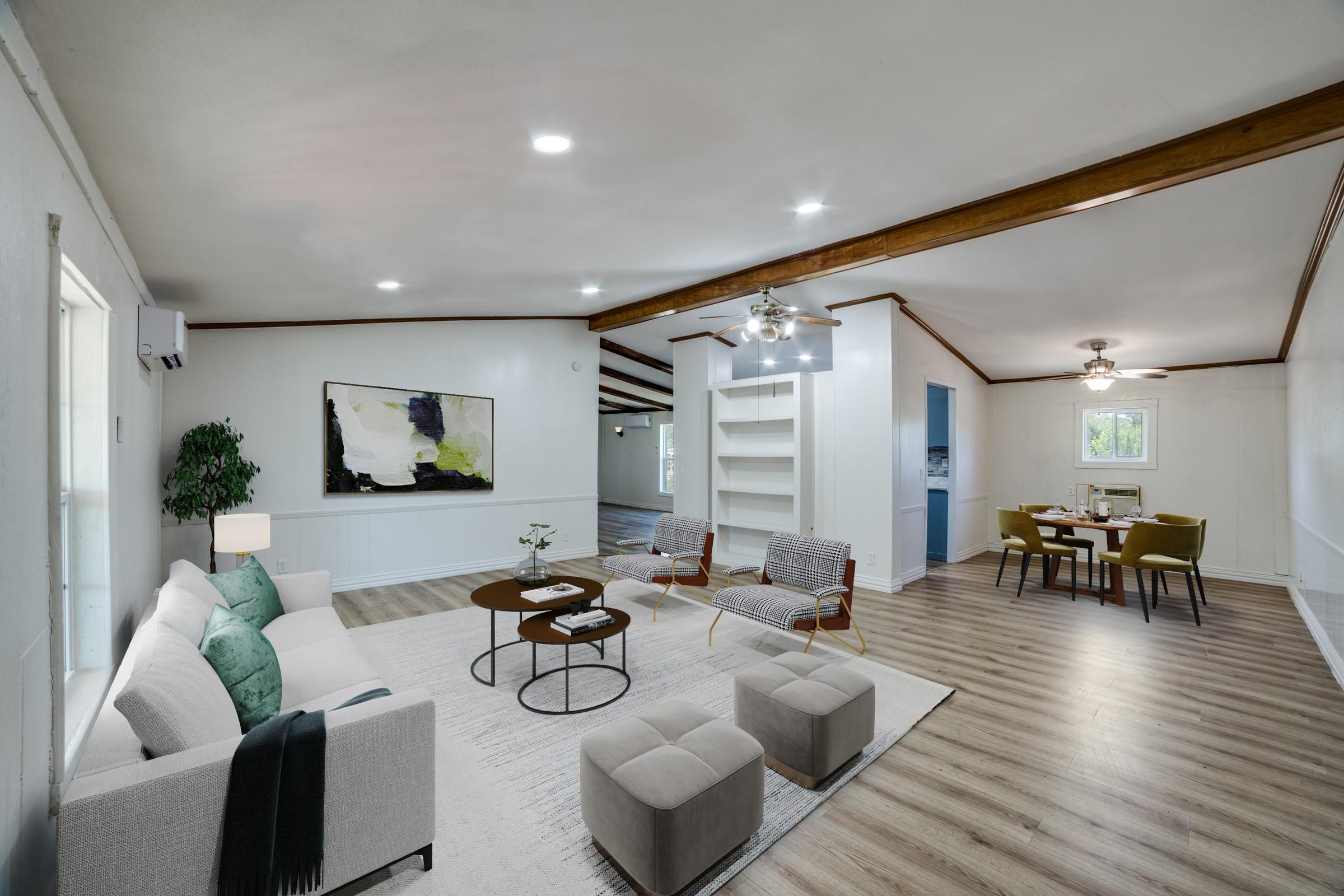 Apartment living room virtually staged with sectional sofa, accent chairs, dining area, and wall art in Elmendorf, Texas