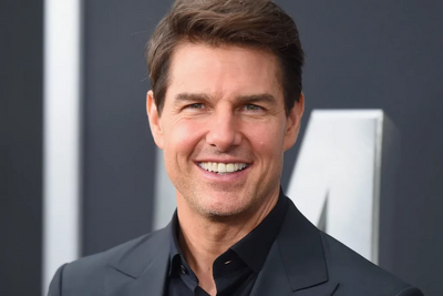 PNG Image of Tom Cruise looking into the camera smiling