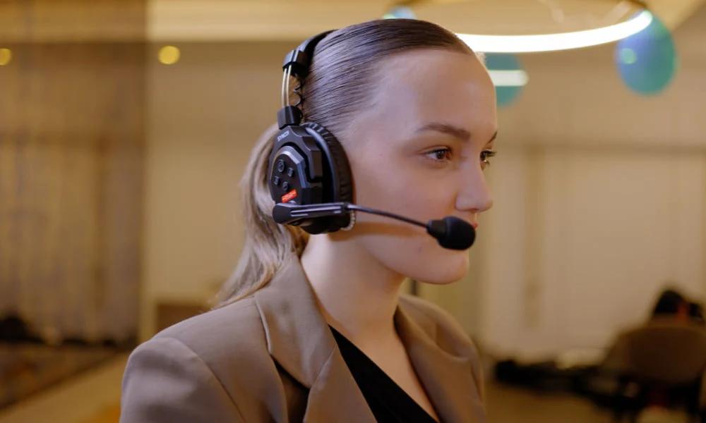 Event coordinator managing logistics on the day of a corporate event