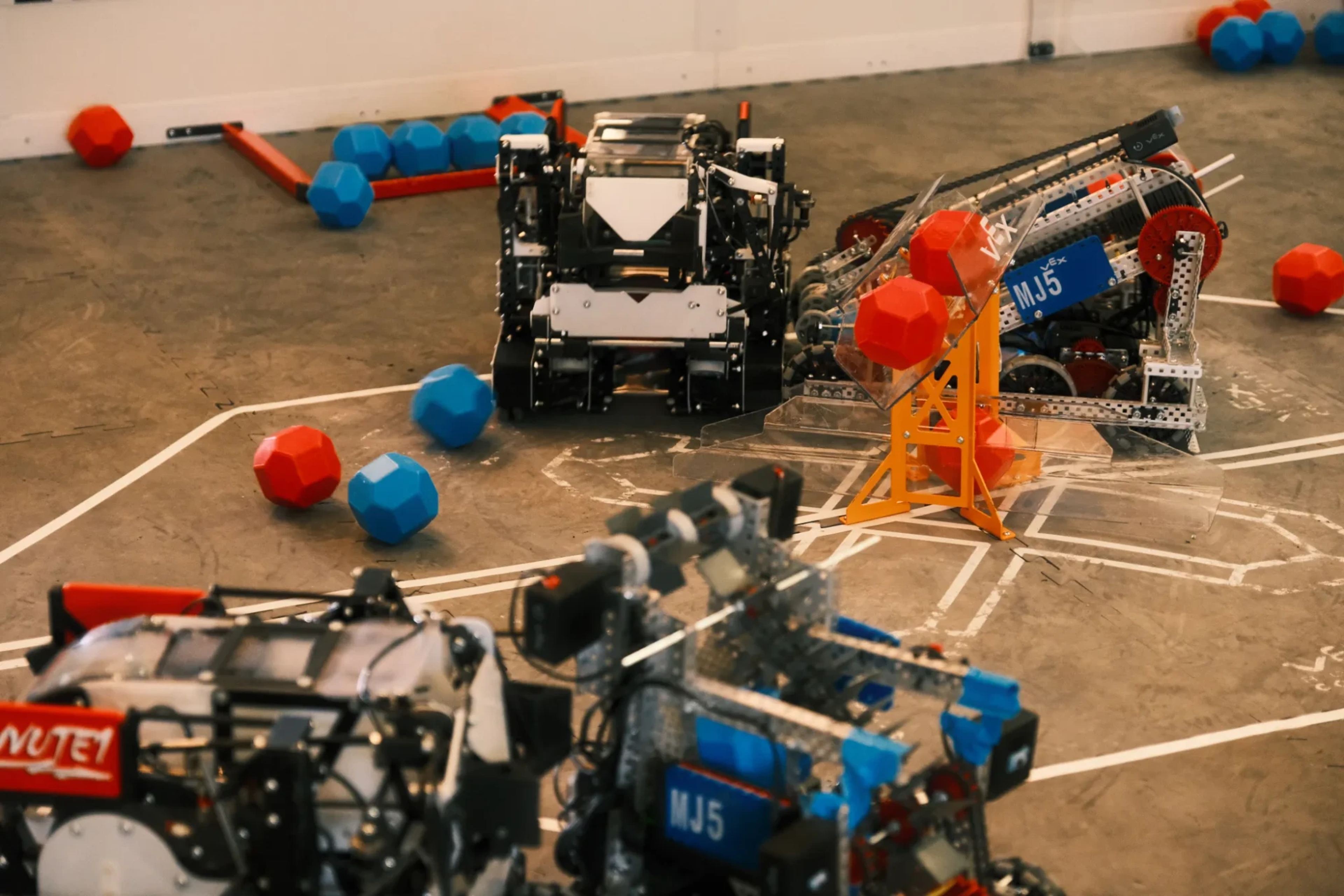 VEX robots competing in a match