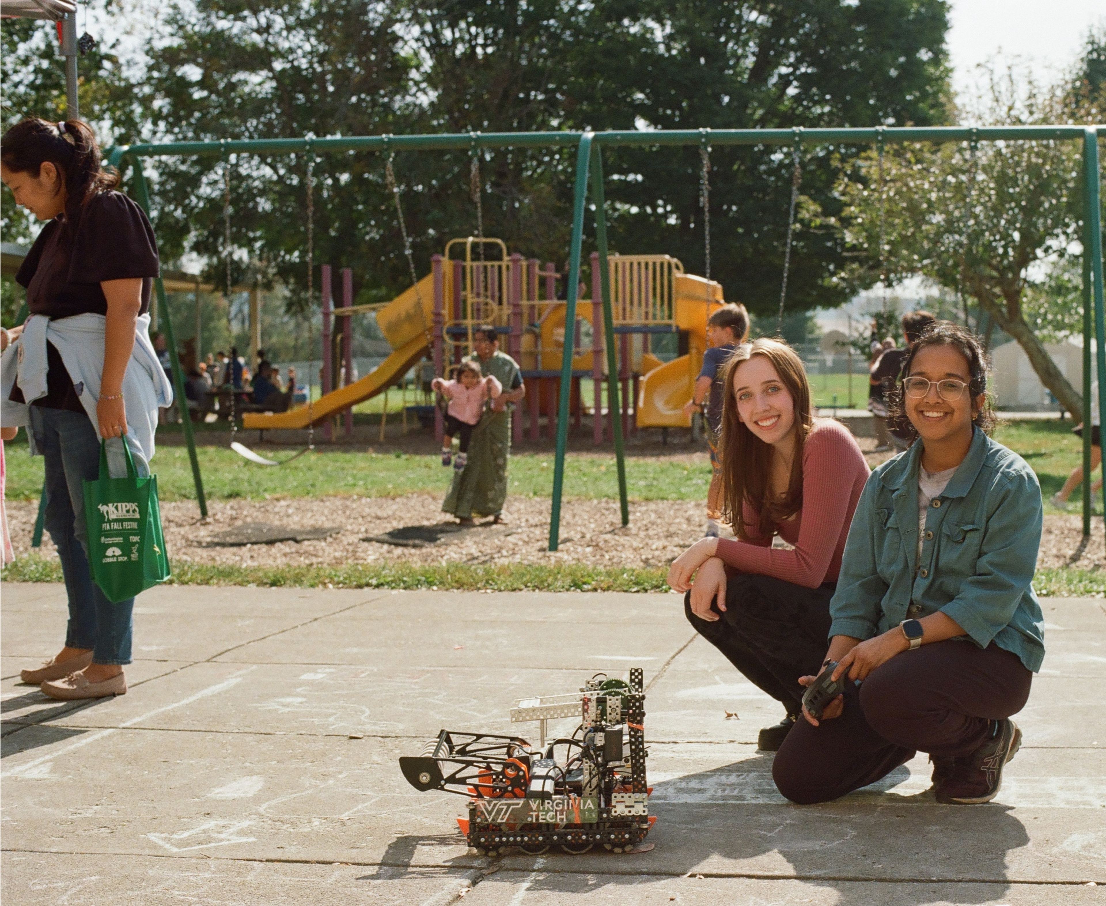 VT CRO members showing a robot at a community event