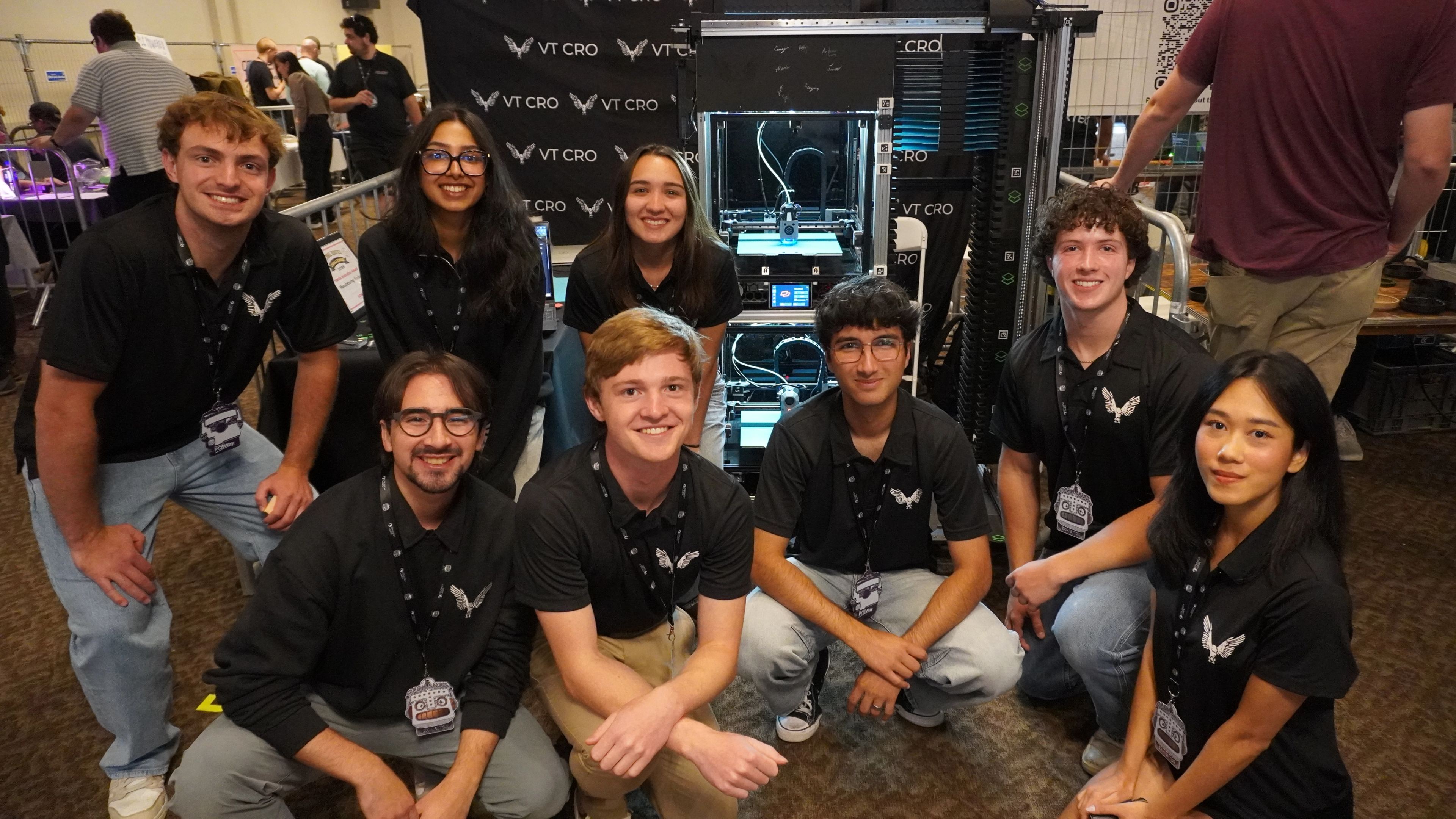 VT CRO members posing together at their exhibit booth