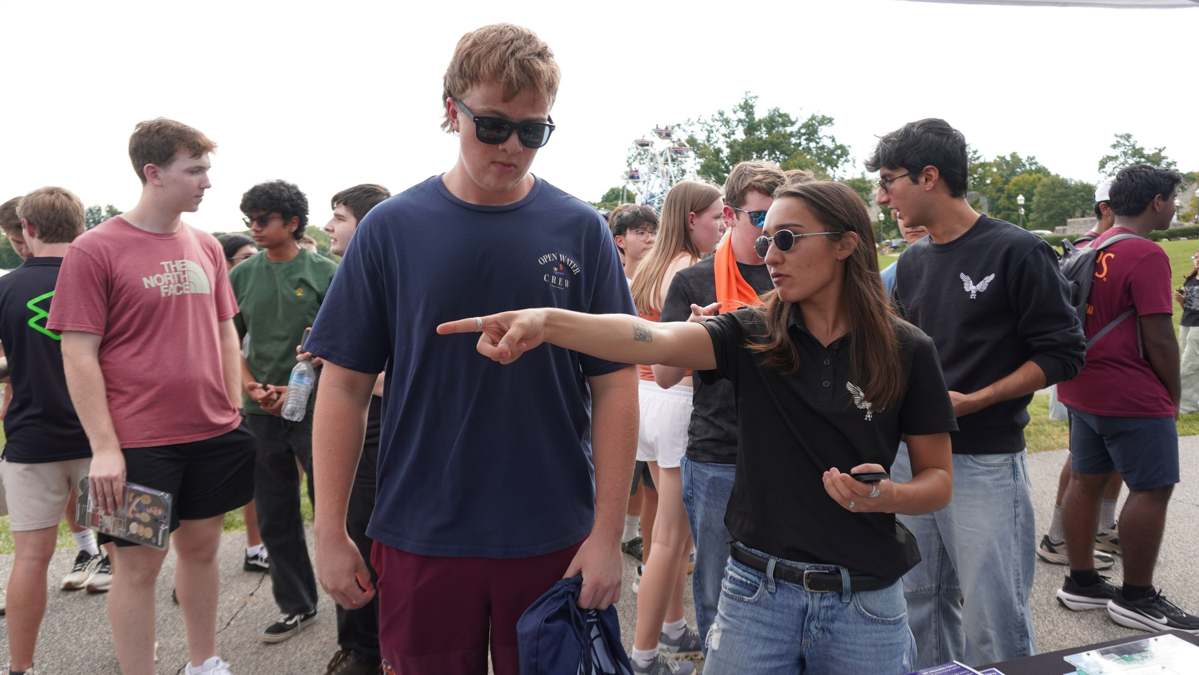 A member pointing a student toward the VT CRO table