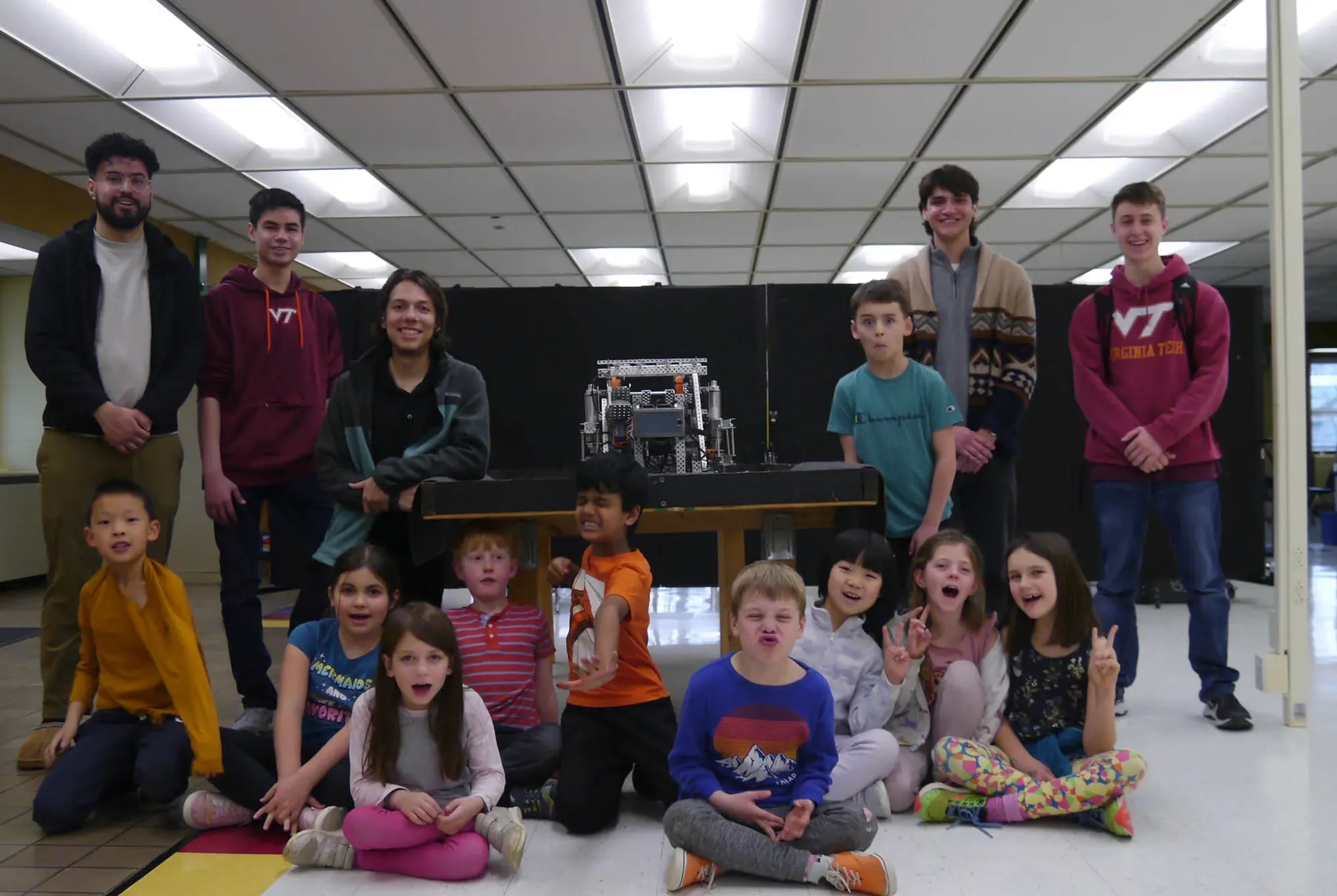 VT CRO members with students at an outreach event