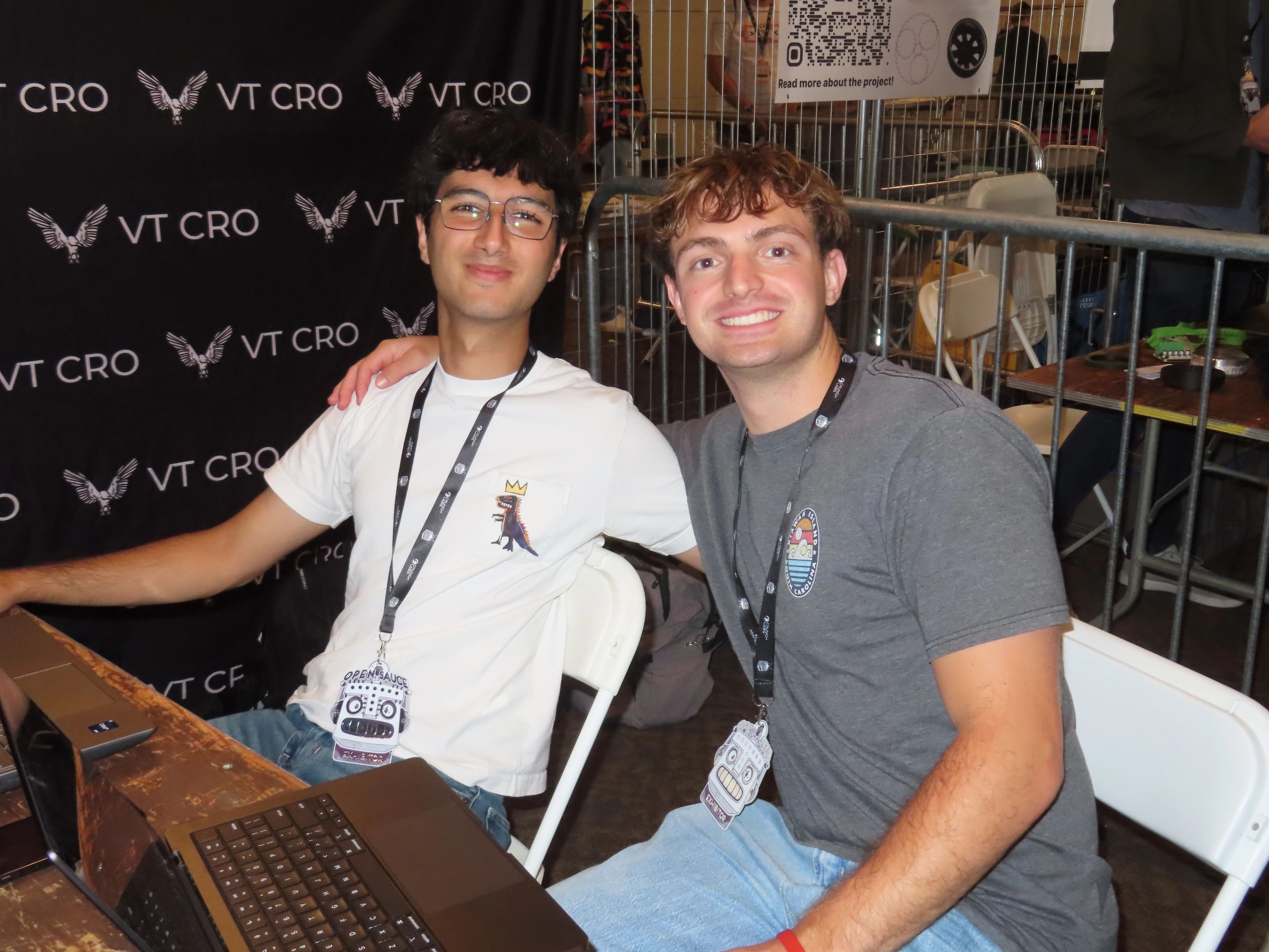 Two members smiling at the VT CRO booth