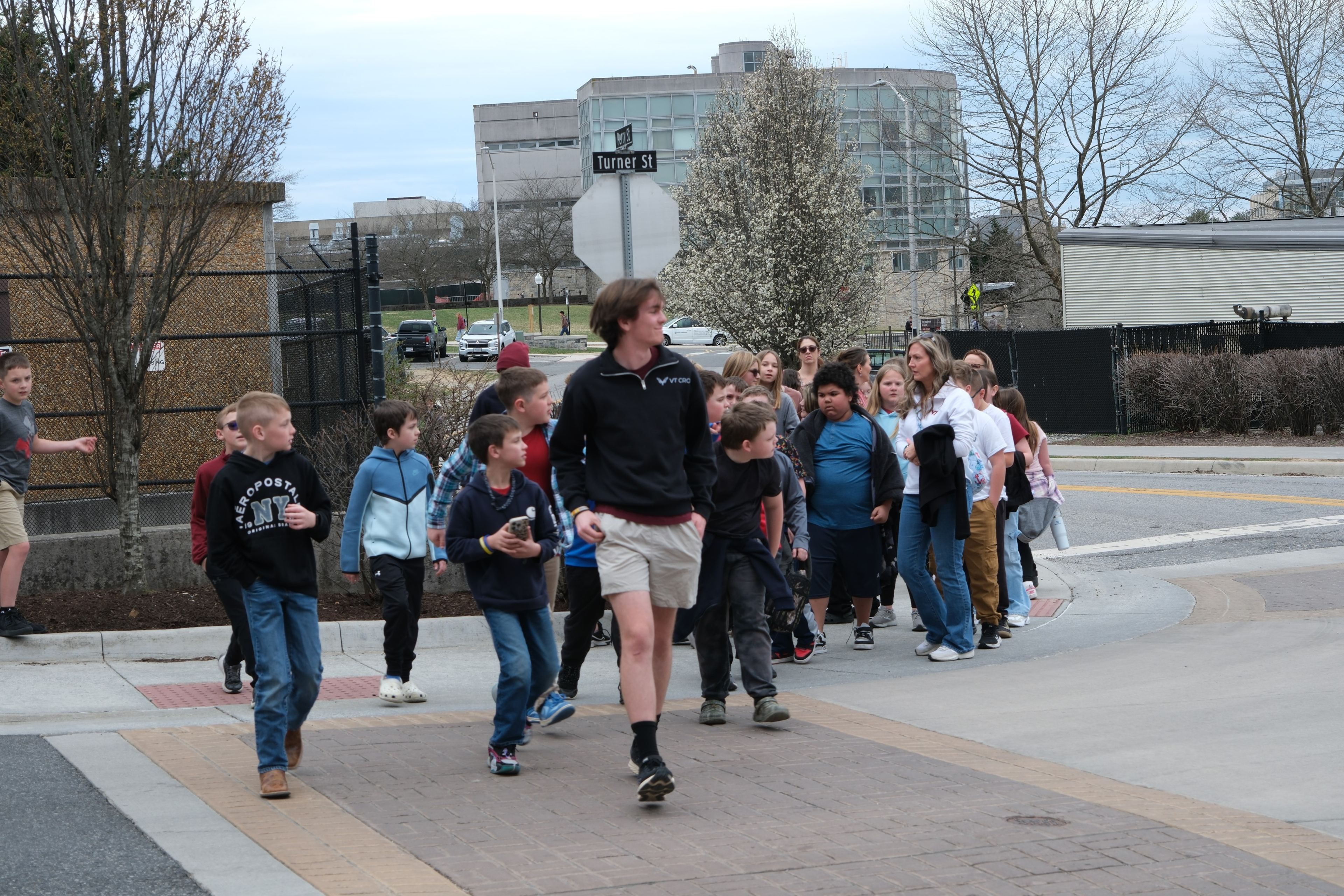 A VT CRO member leading a group of kids across campus
