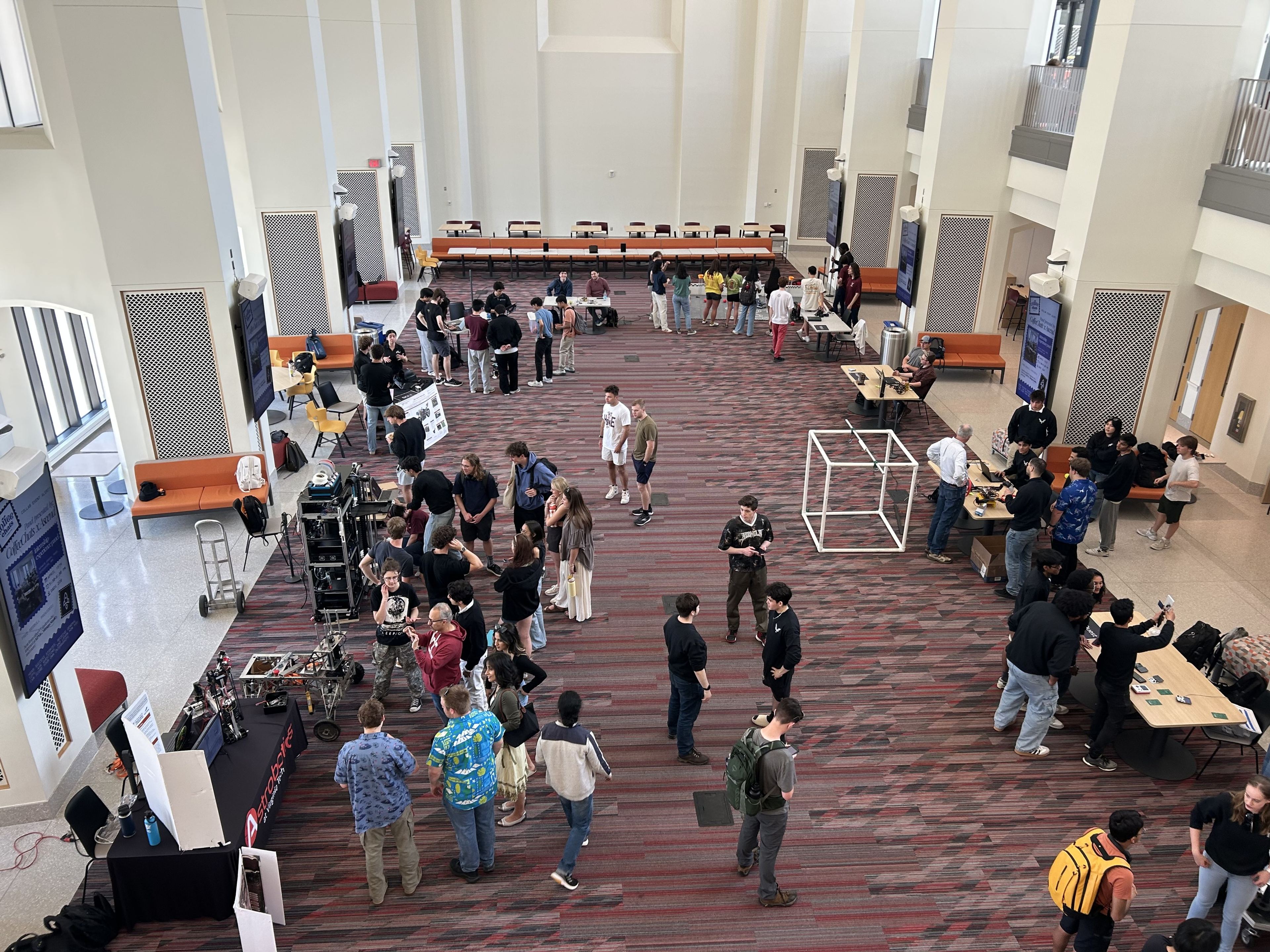 Design teams demonstrating their projects to visitors at CRO Expo
