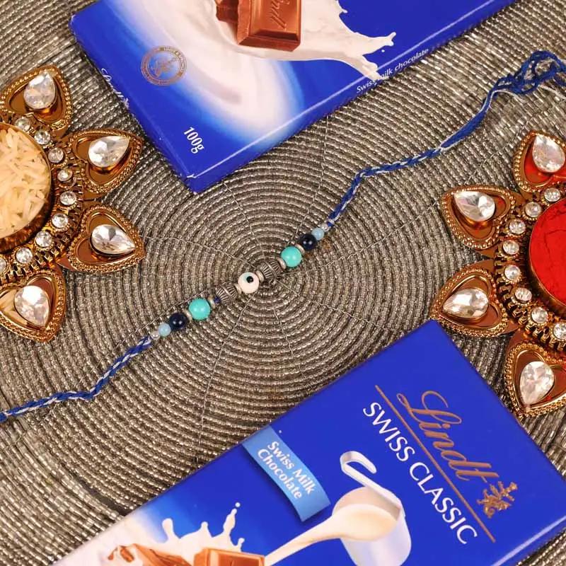 evil-eye-rakhi-and-lindt-chocolate_1.webp
