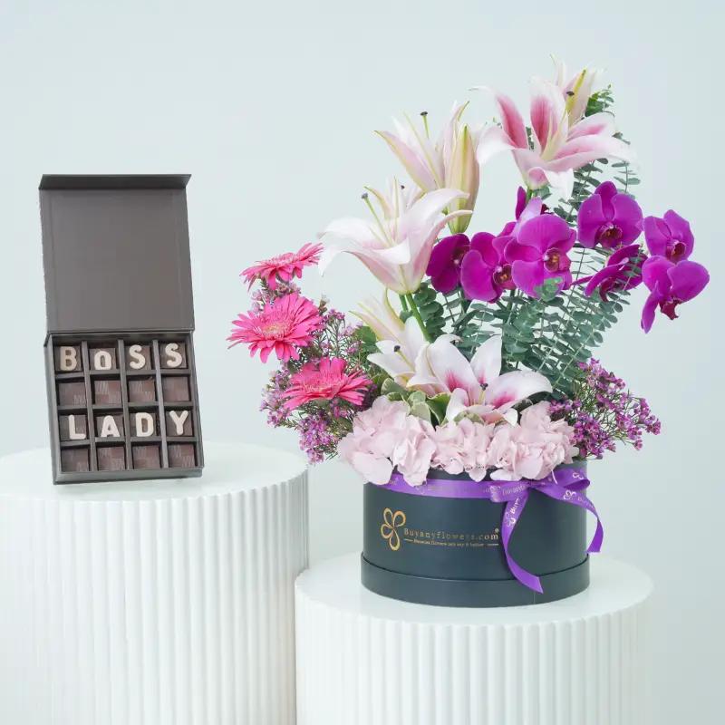 Valley Flower Box With Boss Lady Chocolate - Gift Sets gift from Buy Any Flowers Dubai in Al Quoz Industrial Area 4, Dubai, UAE