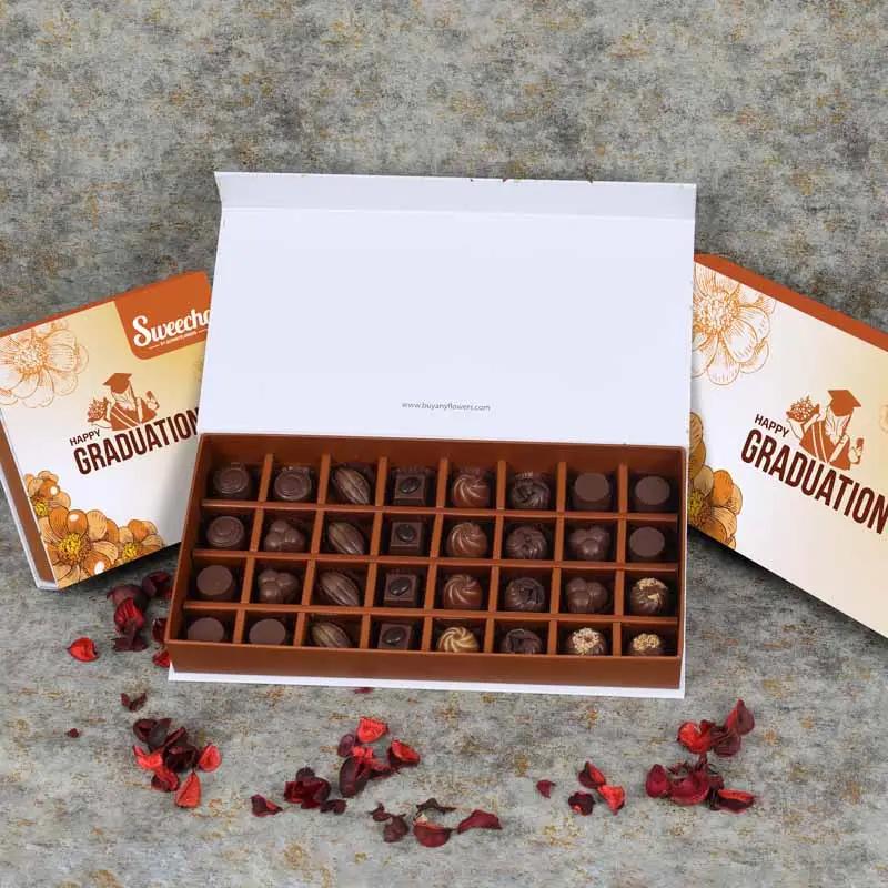 Graduation Premium Assorted Chocolates 32 Pcs By Sweecho - Chocolates gift from Buy Any Flowers Dubai in Al Quoz Industrial Area 4, Dubai, UAE