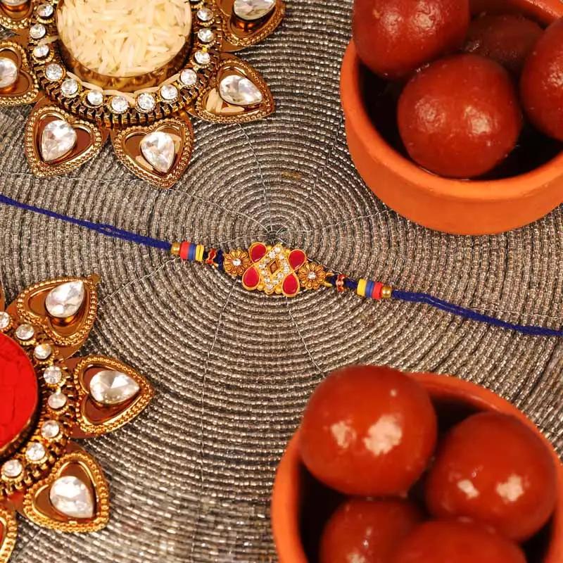 Designer Kundan Rakhi and Gulab Jamun - Gifts gift from Buy Any Flowers Dubai in Al Quoz Industrial Area 4, Dubai, UAE