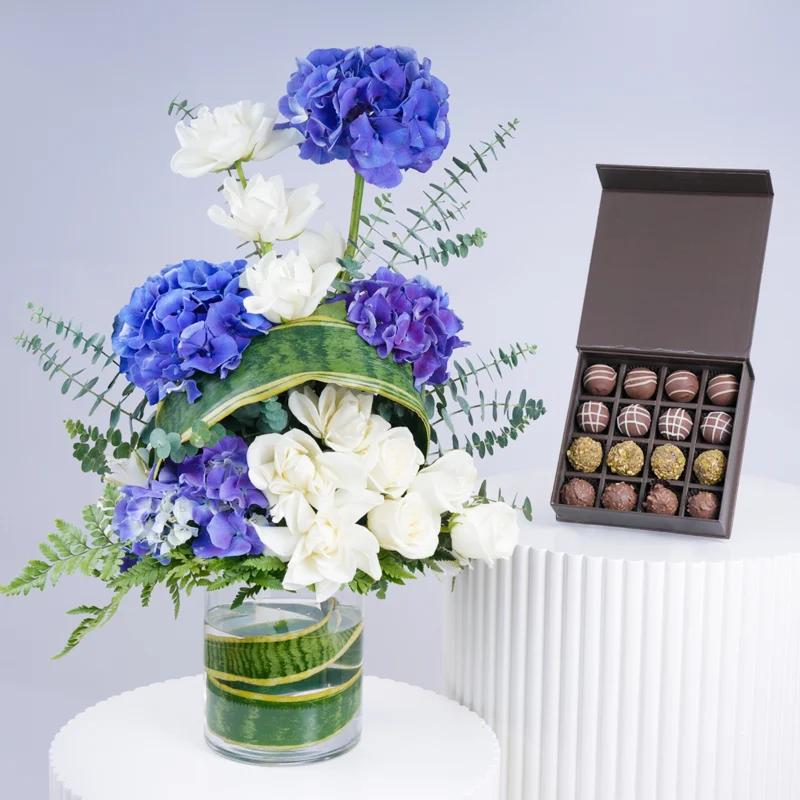 Blue Bliss Flower Arrangement With Chocolate - Gift Sets gift from Buy Any Flowers Dubai in Al Quoz Industrial Area 4, Dubai, UAE