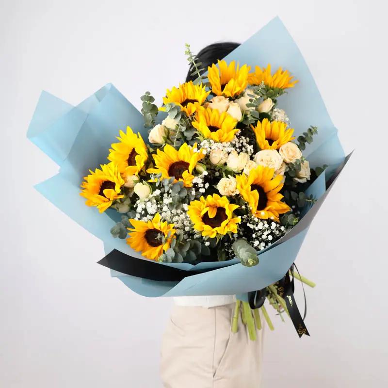 Peachy Sunflowers and Roses Bouquet - Flowers gift from Buy Any Flowers Dubai in Al Quoz Industrial Area 4, Dubai, UAE