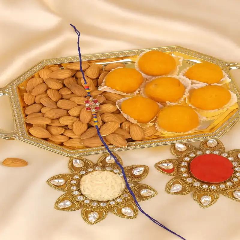 Kundan Rakhi and Motichoor Laddoo and Almond Platter - Gifts gift from Buy Any Flowers Dubai in Al Quoz Industrial Area 4, Dubai, UAE