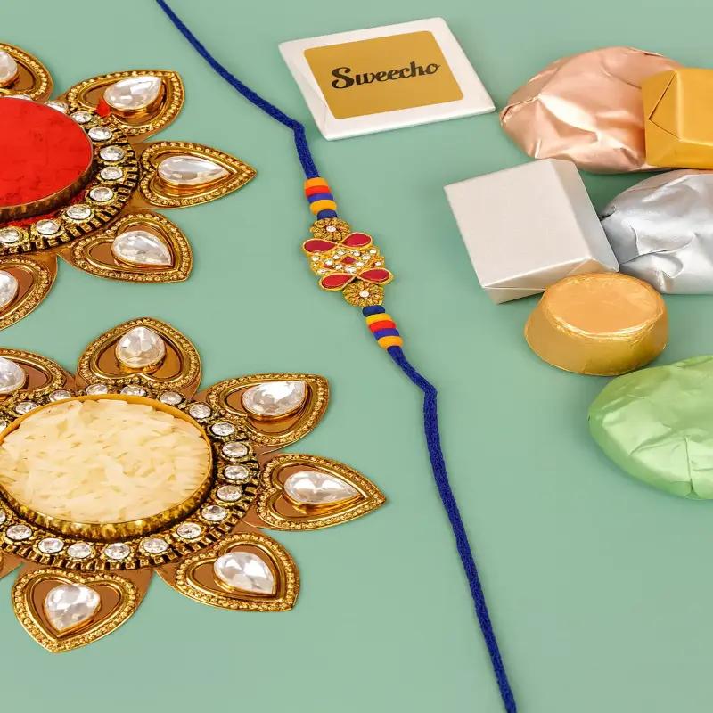 Designer Kundan Rakhi and Assorted Chocolates 100gm - Gifts gift from Buy Any Flowers Dubai in Al Quoz Industrial Area 4, Dubai, UAE