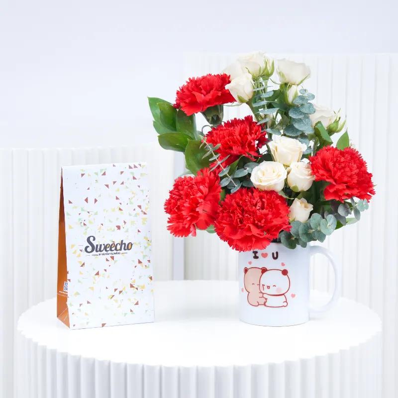 Thought 7 Carnation and Roses in Mug With Chocolate - Gift Sets gift from Buy Any Flowers Dubai in Al Quoz Industrial Area 4, Dubai, UAE