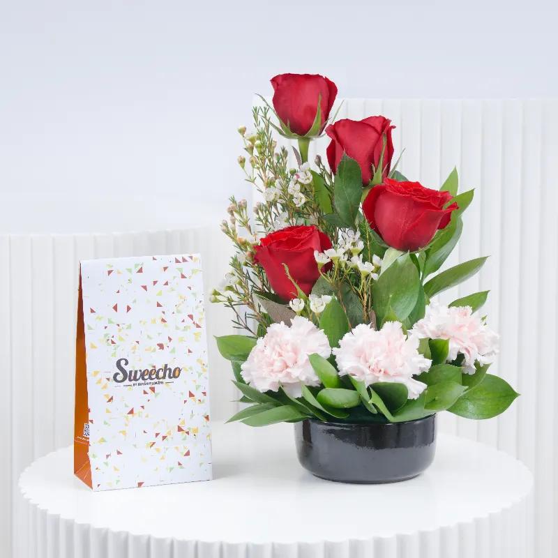 Memories 7 Roses and Carnation Arrangement With Chocolate - Gift Sets gift from Buy Any Flowers Dubai in Al Quoz Industrial Area 4, Dubai, UAE