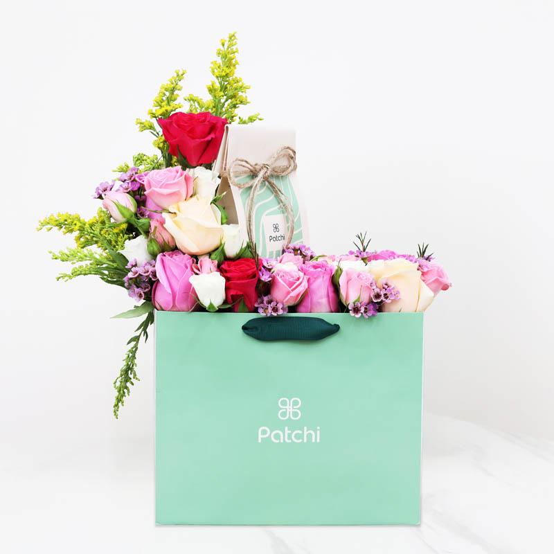 Petals And Chocolates Pink Flowers With Patchi Chocolate Bag - Flowers gift from Buy Any Flowers Dubai in Al Quoz Industrial Area 4, Dubai, UAE