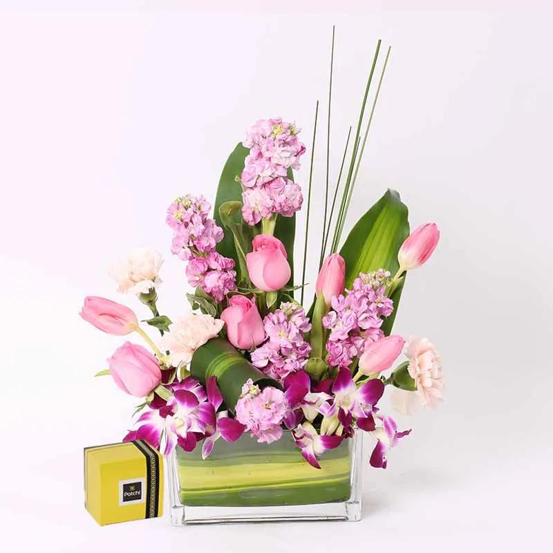 Pretty Lady Vase Arrangement and Deluxe Patchi Chocolates - Gift Sets gift from Buy Any Flowers Dubai in Al Quoz Industrial Area 4, Dubai, UAE