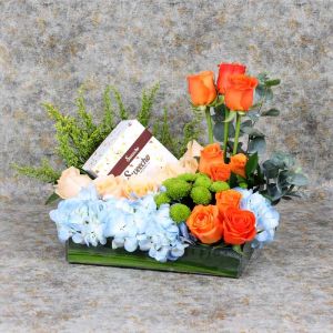 skyflowersandchocolatearrangement_ec930b.webp