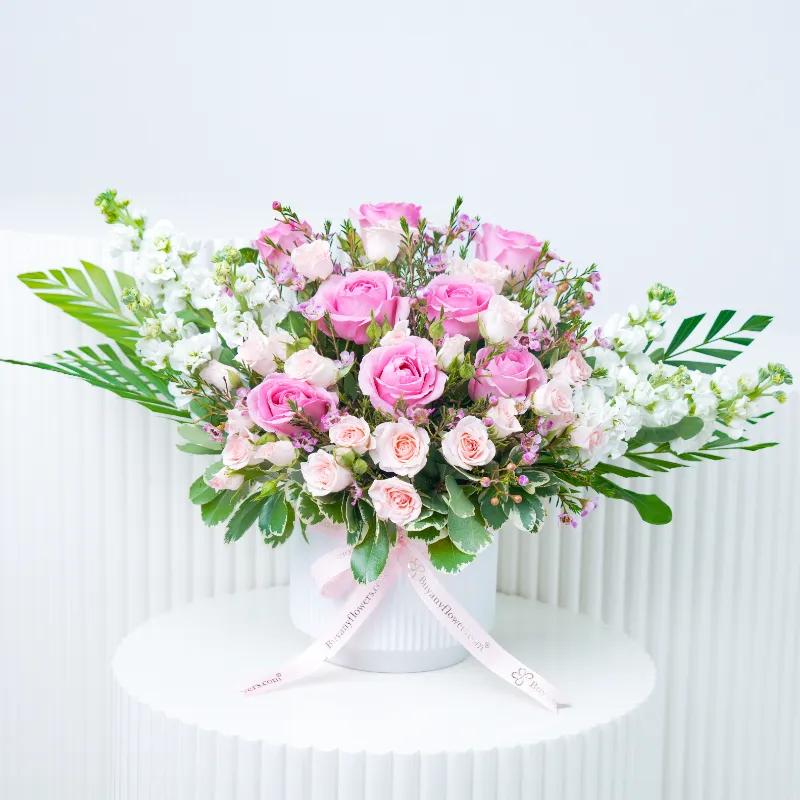 Blush Flowers in White Ceramic Pot in Dubai