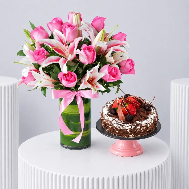 Roses n Lilies with Black Forest Cake - Gift Sets gift from Buy Any Flowers Dubai in Al Quoz Industrial Area 4, Dubai, UAE