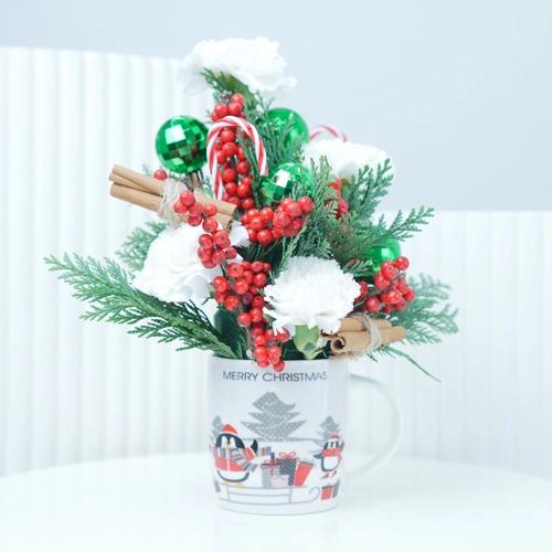 زهور بهجة الكريسماس في كوب 1