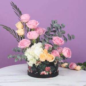 pastel-flowers-in-floral-printed-box_1.webp