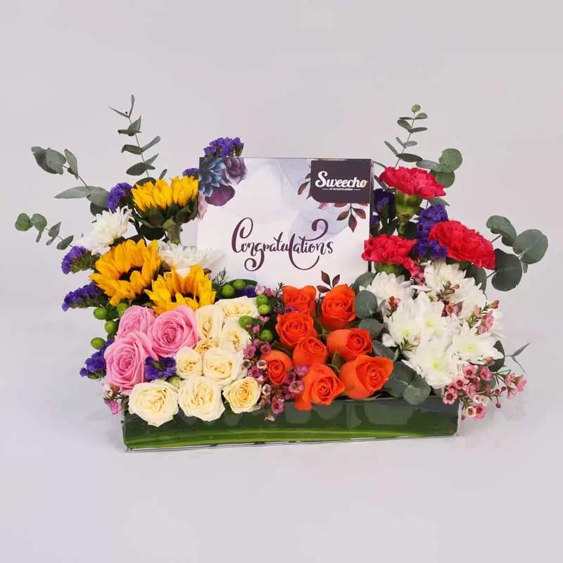 applause-flowers-and-congrutalations-chocolate-arrangement_1.webp