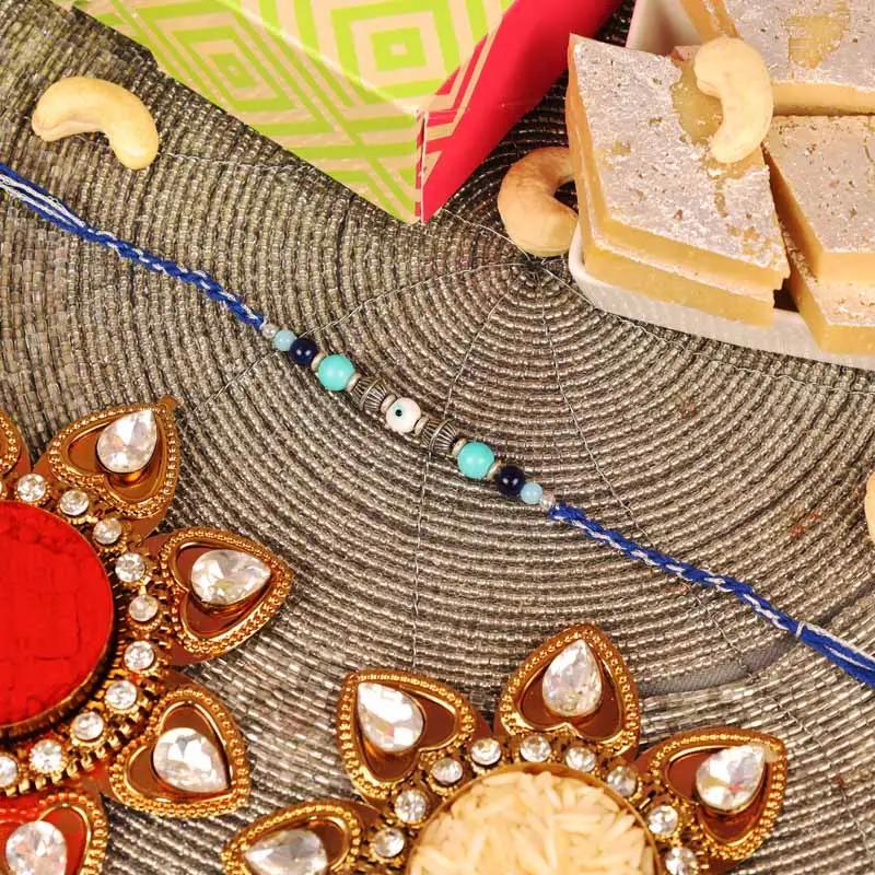 evil-eye-rakhi-and-kaju-katli_1.webp