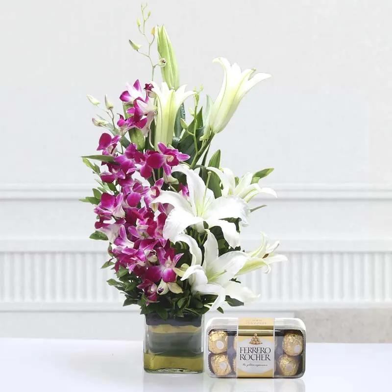 orchid-n-lilies-arrangement-with-chocolates_1.webp