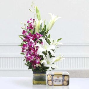 orchid-n-lilies-arrangement-with-chocolates_1.webp