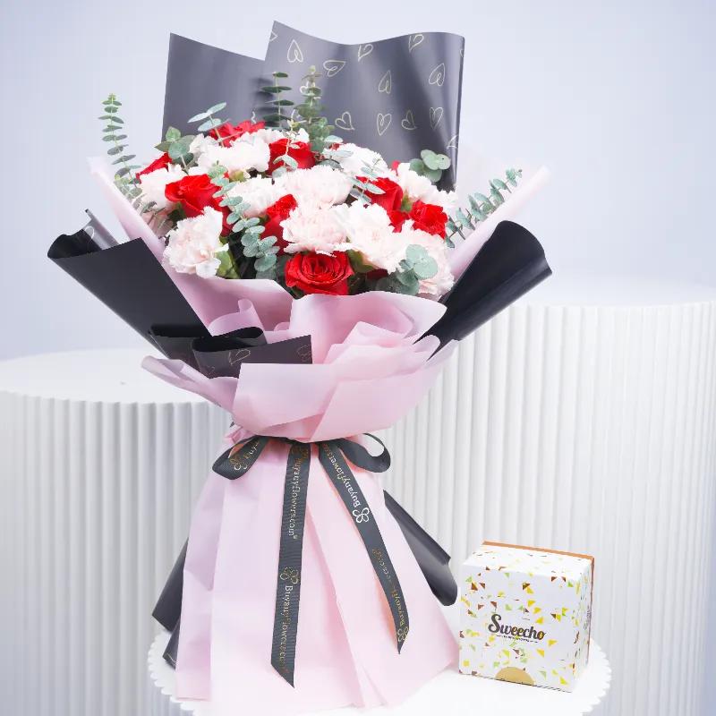 Queen 21 Red Roses and Pink Carnations Bouquet With Chocolates - Gift Sets gift from Buy Any Flowers Dubai in Al Quoz Industrial Area 4, Dubai, UAE