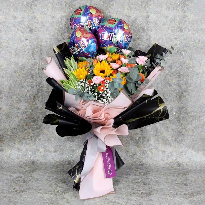 sunburst-flowers-and-congrats-balloons-bouquet_1.webp