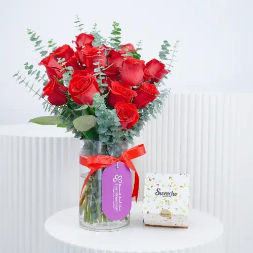 Beauty 21 Red Roses Vase and Chocolates in Dubai