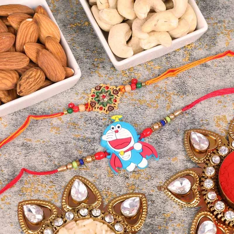 designer-and-doremon-rakhi-with-cashews-and-almonds-set-of-2_1.webp